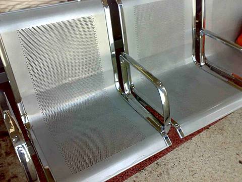 Metal chairs made of round hole perforated steel sheets