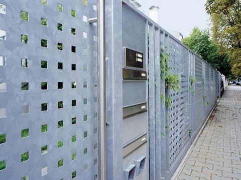 Metal fence which is made of perforated galvanized steel sheet with straight square holes
