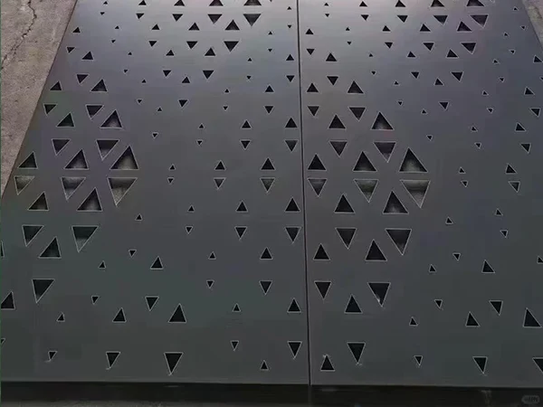 An aluminum carved facade panel with precisely arranged triangular perforations