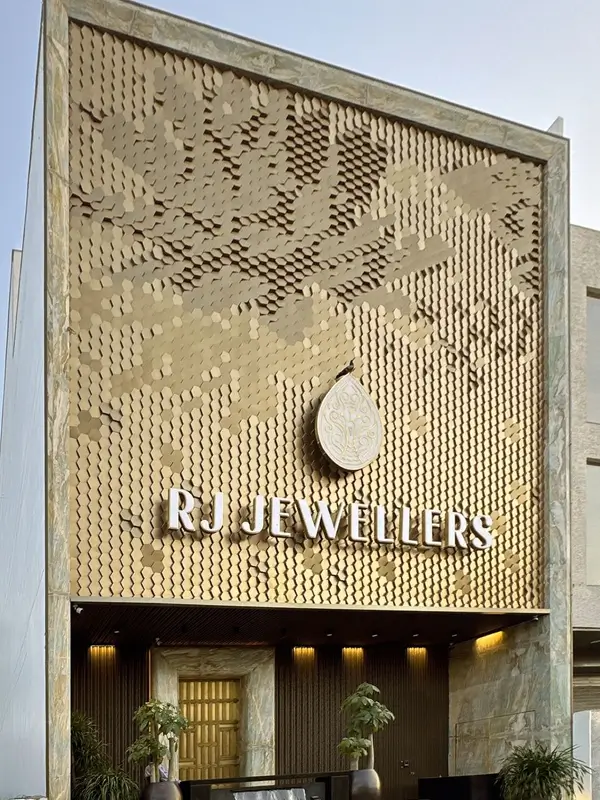The facade of RJ Jewellers features a textured design with back plate mounting.