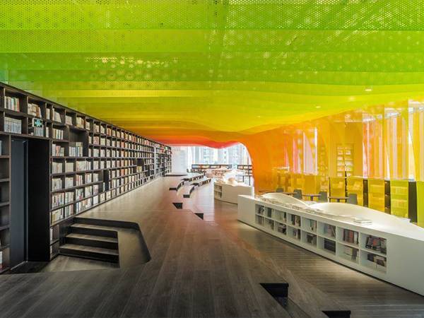 The ceiling of the library decorated with decorative perforated sheets in different colors