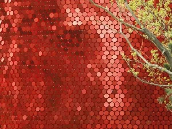 Red round metal perforated kinetic panels