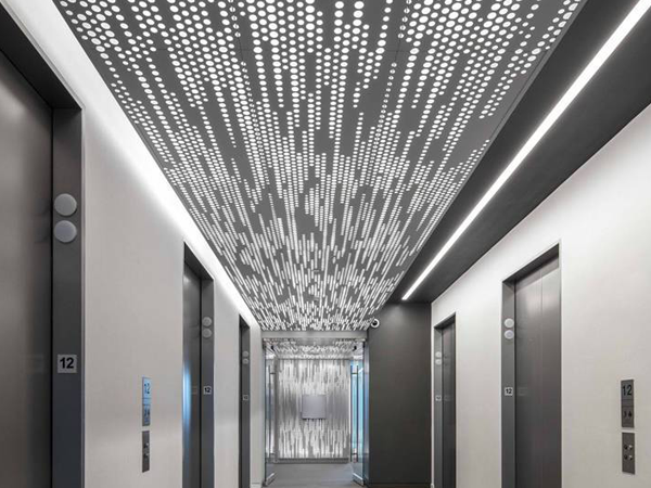 Perforated aluminum sheet as a decorative panel in the large commercial office building