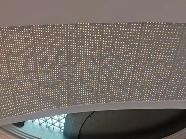 Perforated aluminum sheet used as a shopping mall ceiling