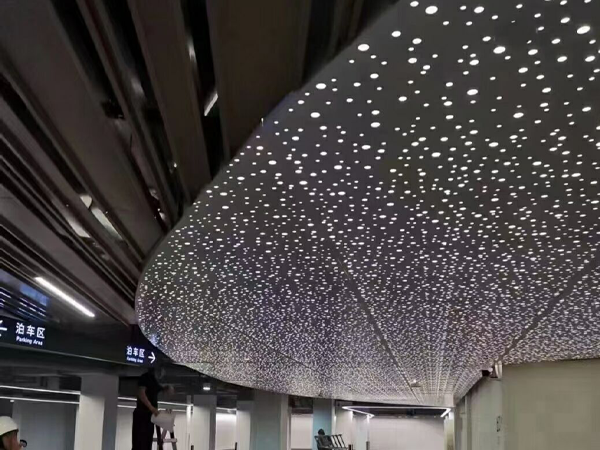 Perforated aluminum sheet used as a decorative panel in the underground parking lot
