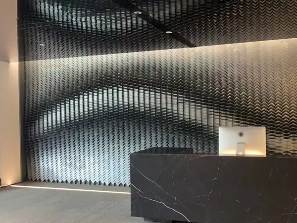 Indoor reception backdrop, perforated kinetic facade