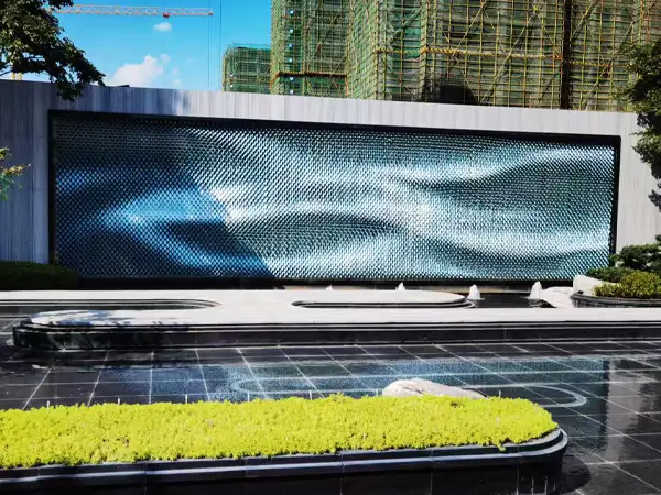 Outdoor decorative wall, perforated kinetic facade